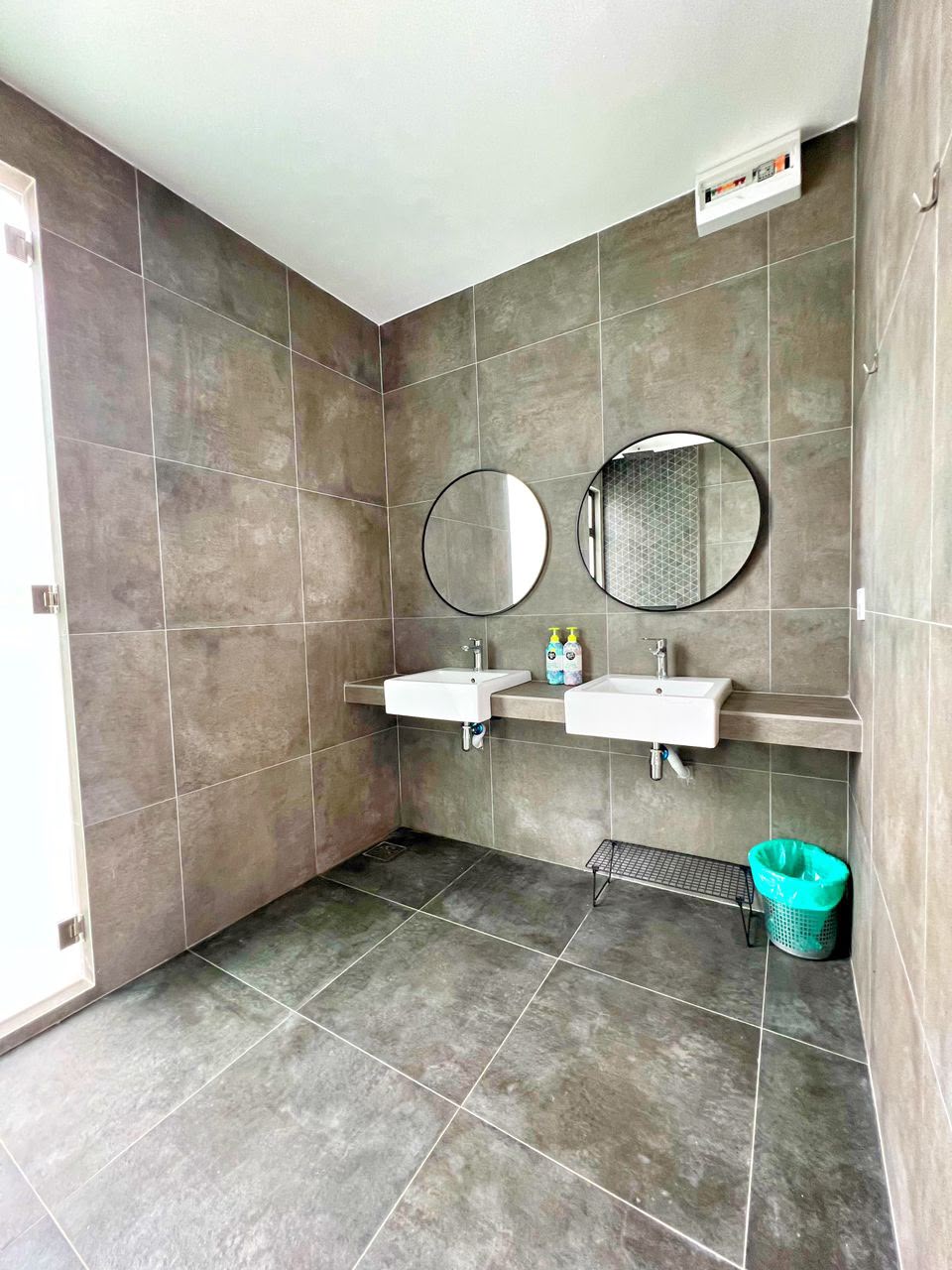 ASTA Suite at Ezu Isle Langkawi villa: en-suite bathroom with double sink and round mirrors