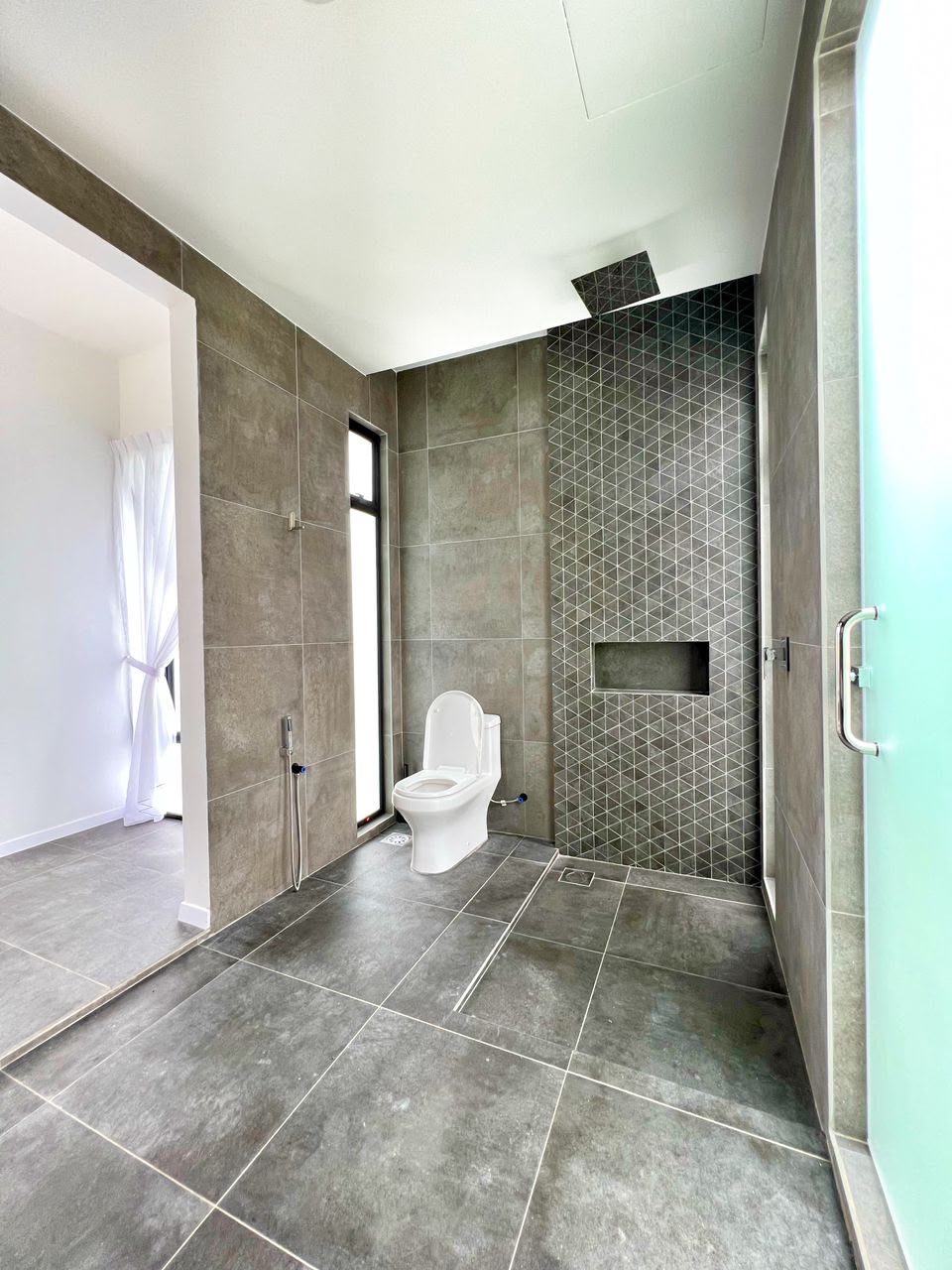 ASTA Suite at Ezu Isle Langkawi villa: walk-in rain shower with ceiling rain head and mosaic tile wall