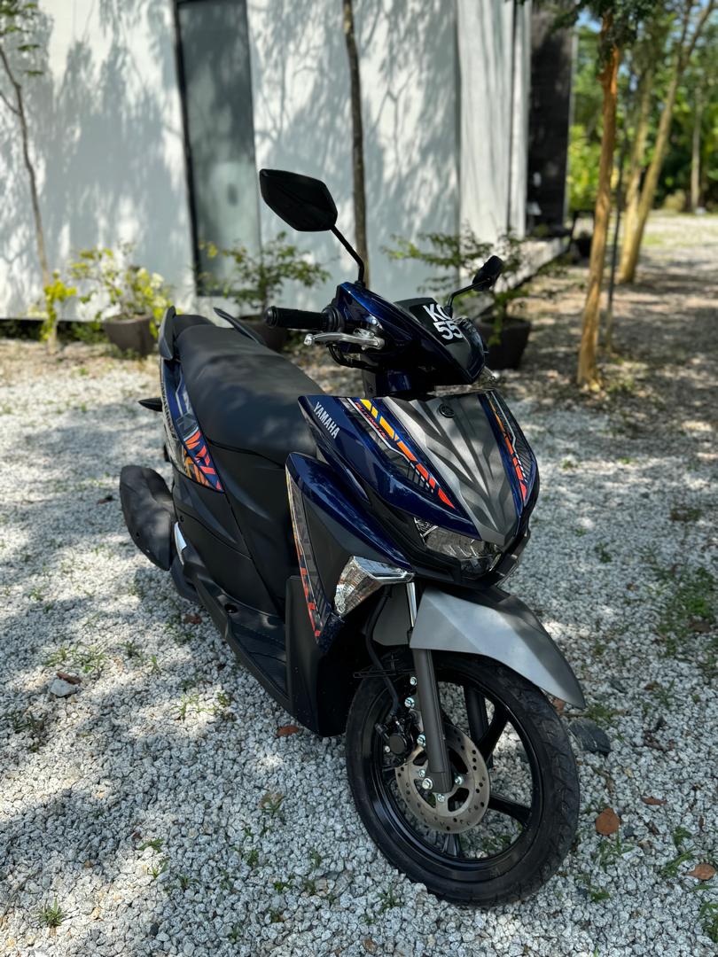 Scooter rental Langkawi at Ezu Isle: blue Yamaha Avantiz scooter parked on the gravel