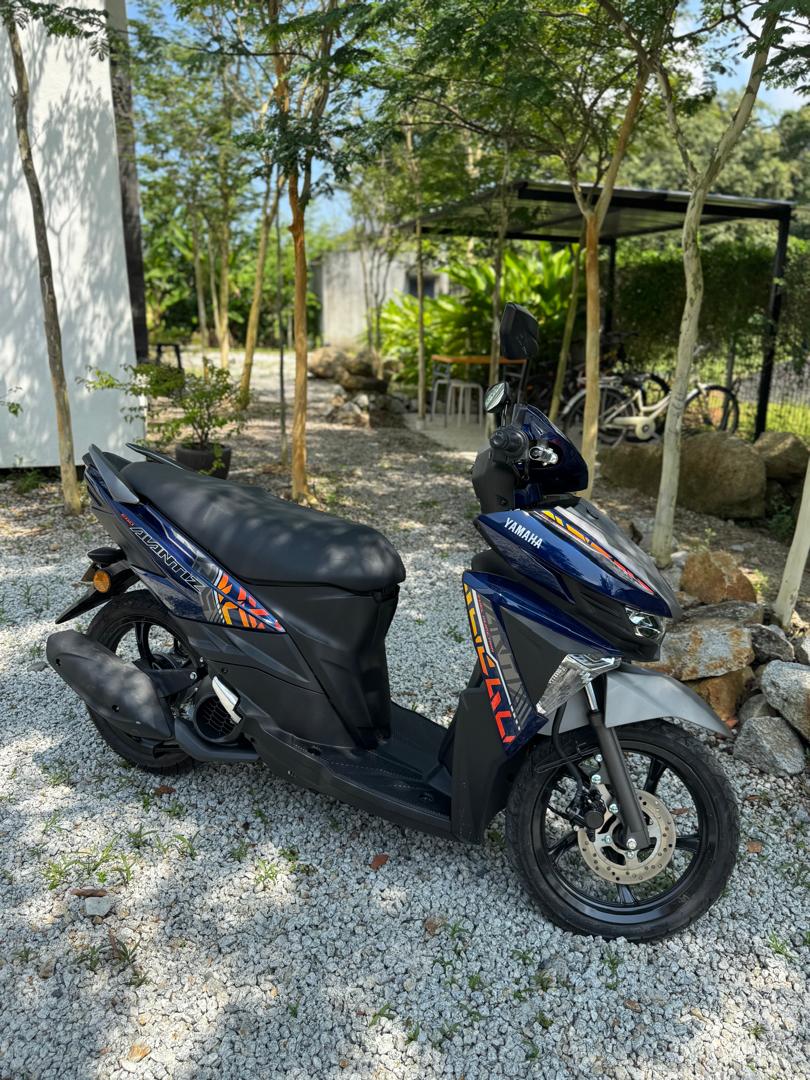 Scooter rental Langkawi at Ezu Isle: Yamaha Avantiz in the villa garden, bicycles behind